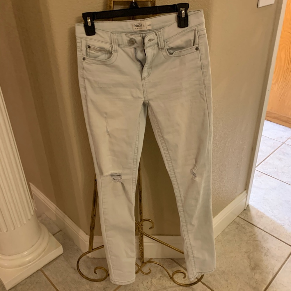 Light blue distressed skinny jeans